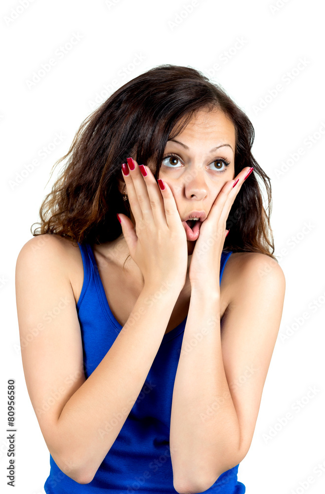 Fototapeta premium Beautiful young surprised woman looking at camera