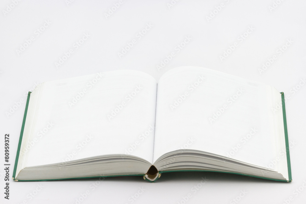 Used open empty book with green cover on white background Used open empty book with green cover on white background
