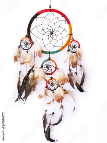 A red,green and black dreamcatcher isolated in white.