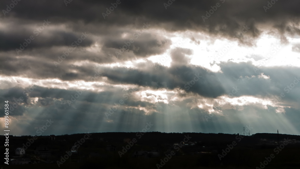 Sun beam in Dark Clouds and Sky before Thunderstorm Sun beam in Dark Clouds and Sky before Thunderstorm