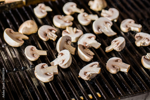 Champignon mushrooms on grill