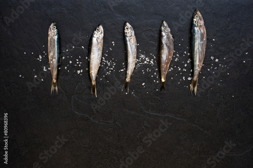 Small fishes with salt on the table