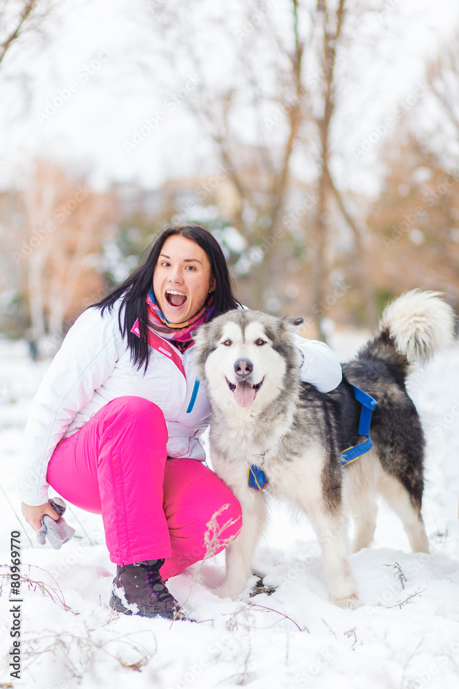 girl with malamute winter