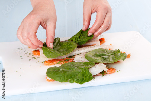 fish rolls with spinach leaves