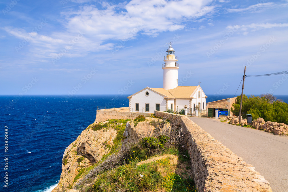 Lighthouse on cliff edge, Cala Ratjada, Majorca island, Spain