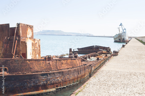 Rusty wreck moored