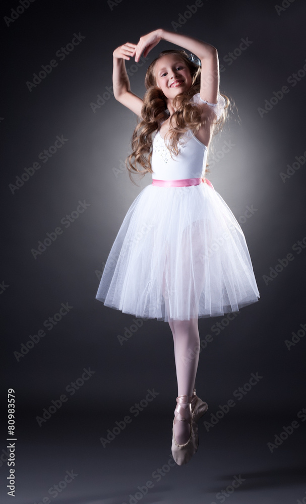 Emotional young ballet dancer posing in jump Emotional young ballet dancer posing in jump