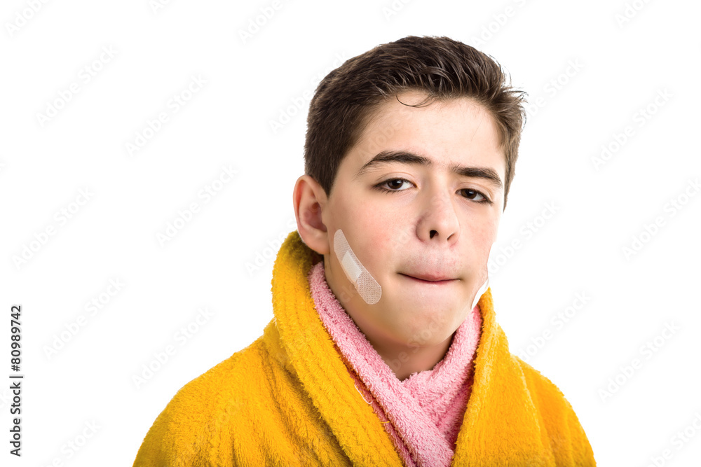 Soft skinned boy stretching the skin above the lip to check cuts Soft skinned boy stretching the skin above the lip to check cuts