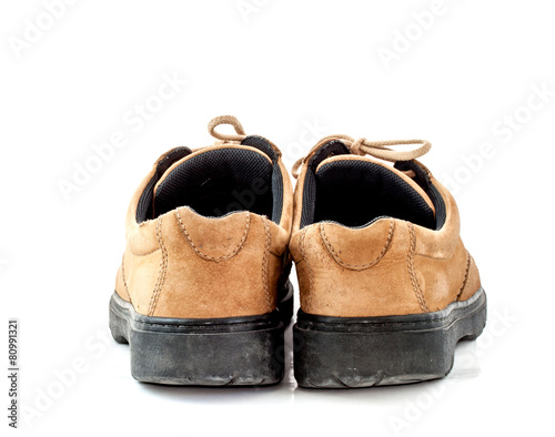 old brown leather shoe on white background