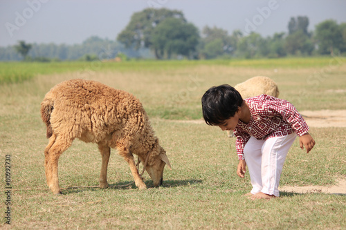 Child with sheep.