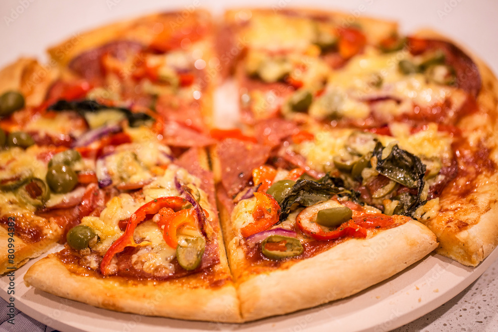 Homemade pizza on white table Homemade pizza on white table