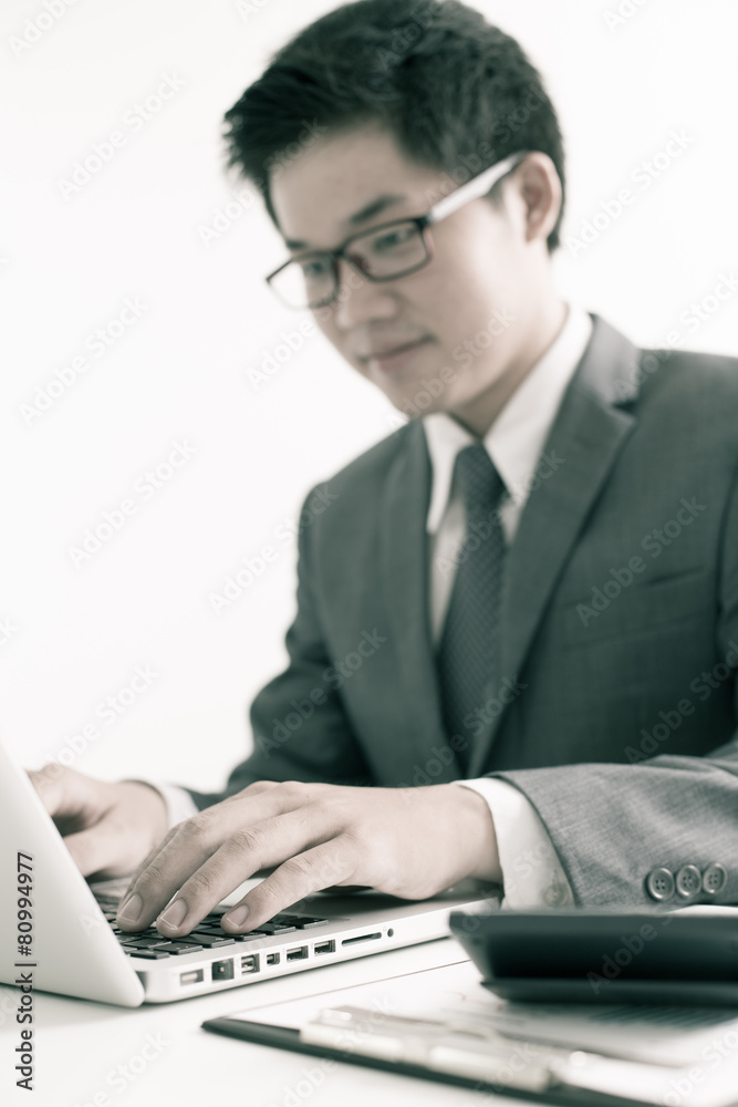 Handsome businessman working with laptop Handsome businessman working with laptop