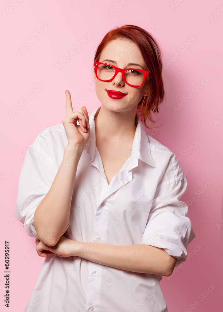 Smiling student girl in white shirt and red glasses Smiling student girl in white shirt and red glasses