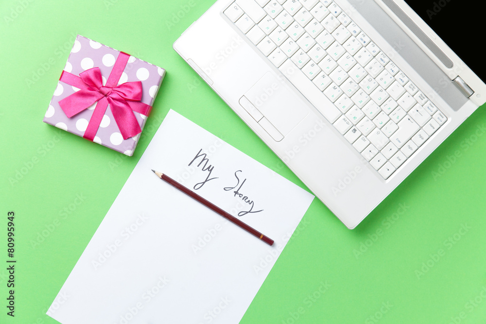 gift and paper near laptop gift and paper near laptop