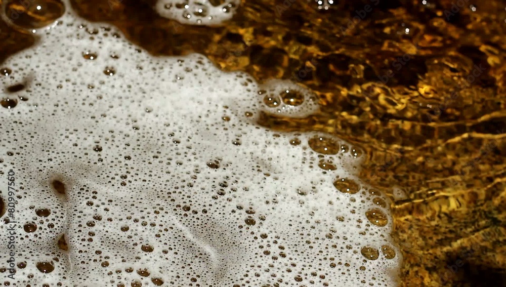Bubbles Swirling In Rock Pool