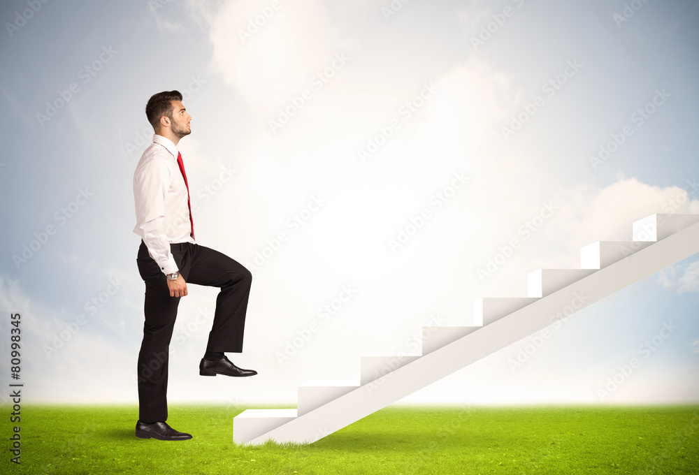 Business person climbing up on white staircase in nature Business person climbing up on white staircase in nature