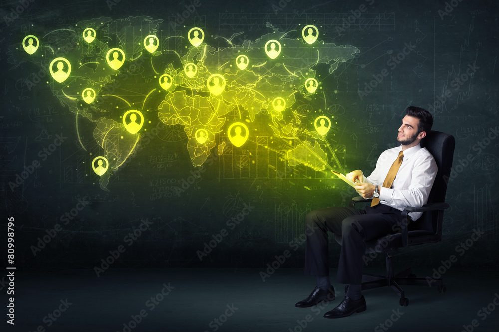 Businessman in office with tablet and social network world map Businessman in office with tablet and social network world map