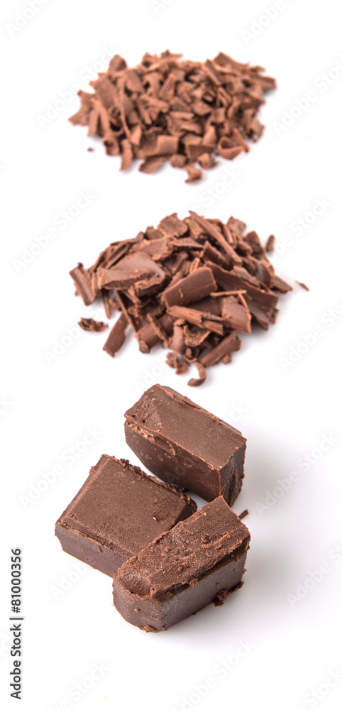 Dark brown chocolate pieces over white background Dark brown chocolate pieces over white background