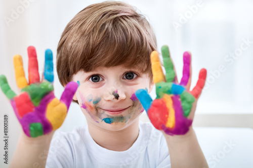 Cute little boy with colored hands