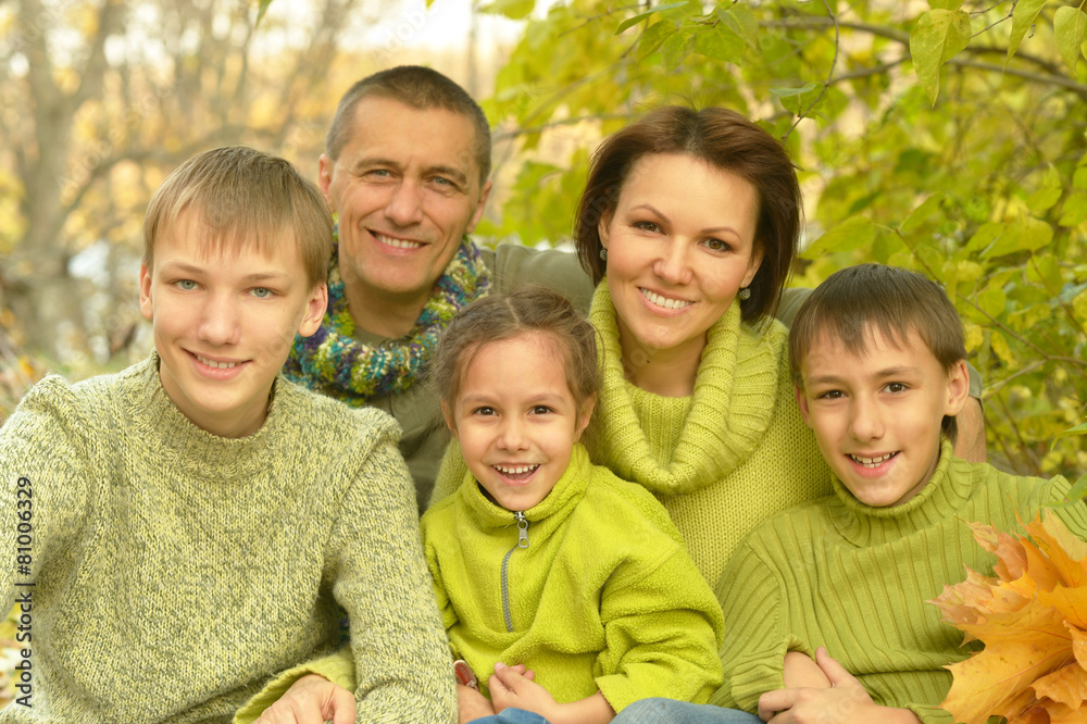 Family relaxing in autumn park Family relaxing in autumn park