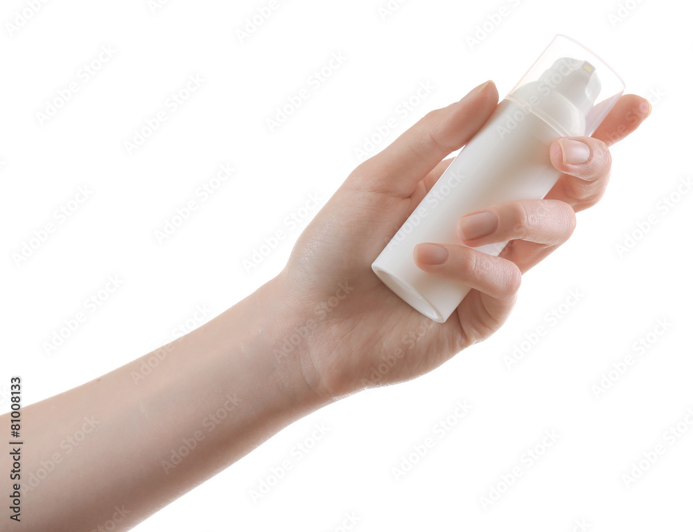 Female hand with cosmetics bottle isolated on white Female hand with cosmetics bottle isolated on white