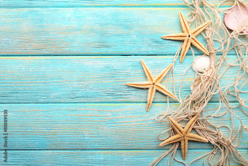 Sea stars and shells on wooden background Sea stars and shells on wooden background