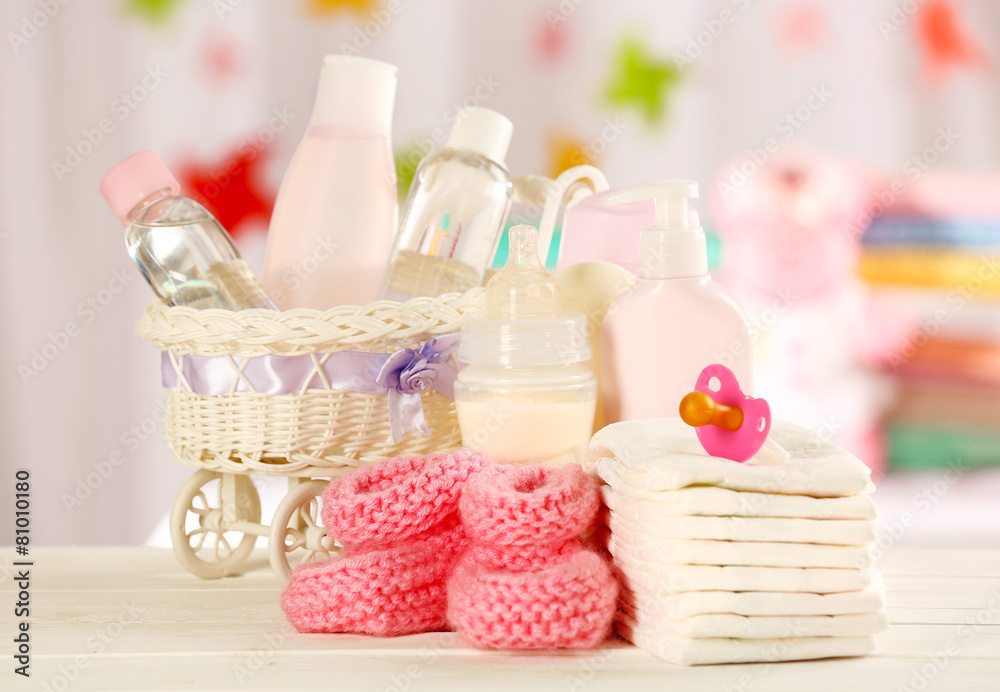 Baby accessories on table on light background Baby accessories on table on light background
