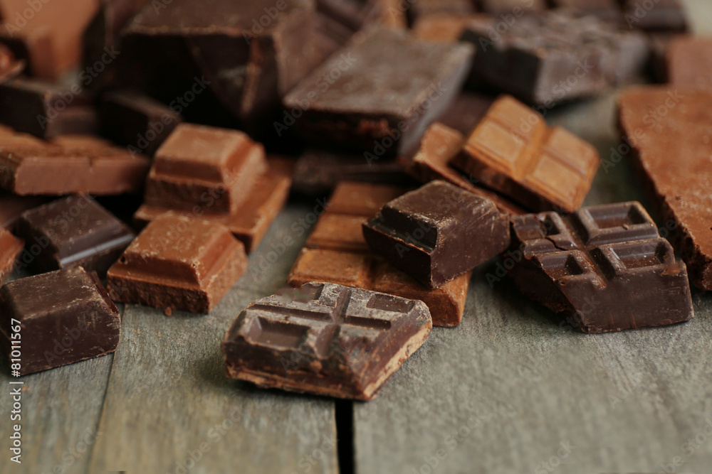 Set of chocolate on wooden table, closeup Set of chocolate on wooden table, closeup