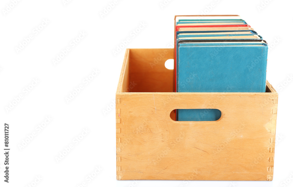 Books in wooden box isolated on white Books in wooden box isolated on white