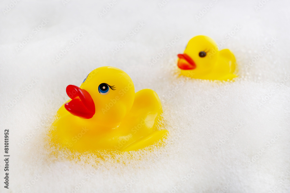 Rubber ducks in foam close-up Rubber ducks in foam close-up