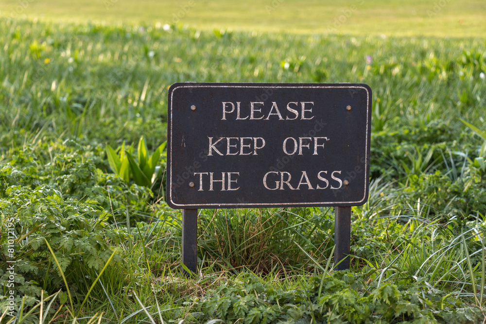 Vintage Caution Sign: Please Keep Off the Grass on grass field b