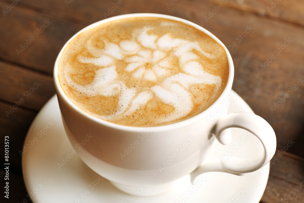 Cup of coffee latte art on wooden table, closeup Cup of coffee latte art on wooden table, closeup