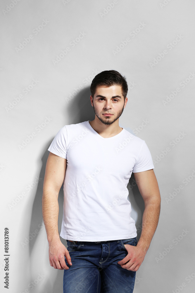 Young man on gray background Young man on gray background