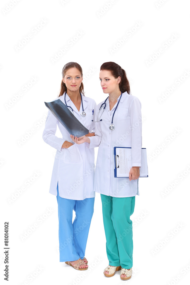 Two woman nurse watching X Ray image, standing in hospital Two woman nurse watching X Ray image, standing in hospital