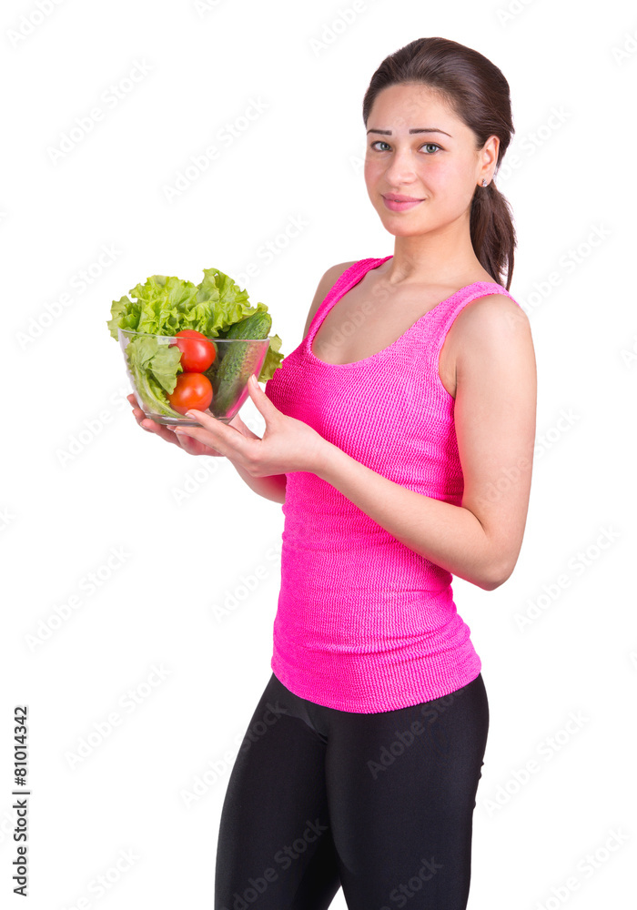 sports girl with a bowl of vegetables