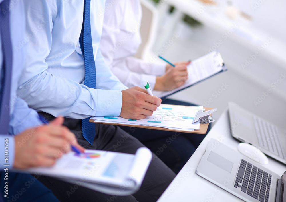 Business people sitting and writting at business meeting, in Business people sitting and writting at business meeting, in