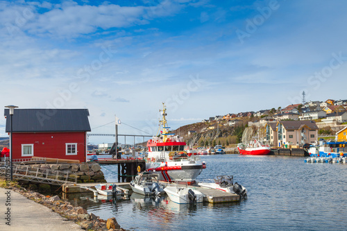 Small Norwegian village landscape, moored boats photo