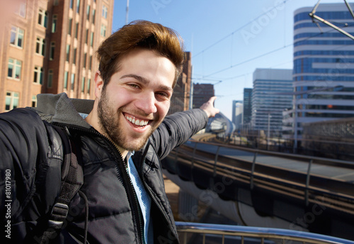 Young man taking selfie in the city