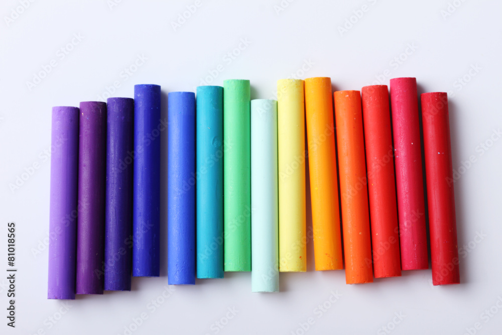 Colorful chalk pastels on white background Colorful chalk pastels on white background