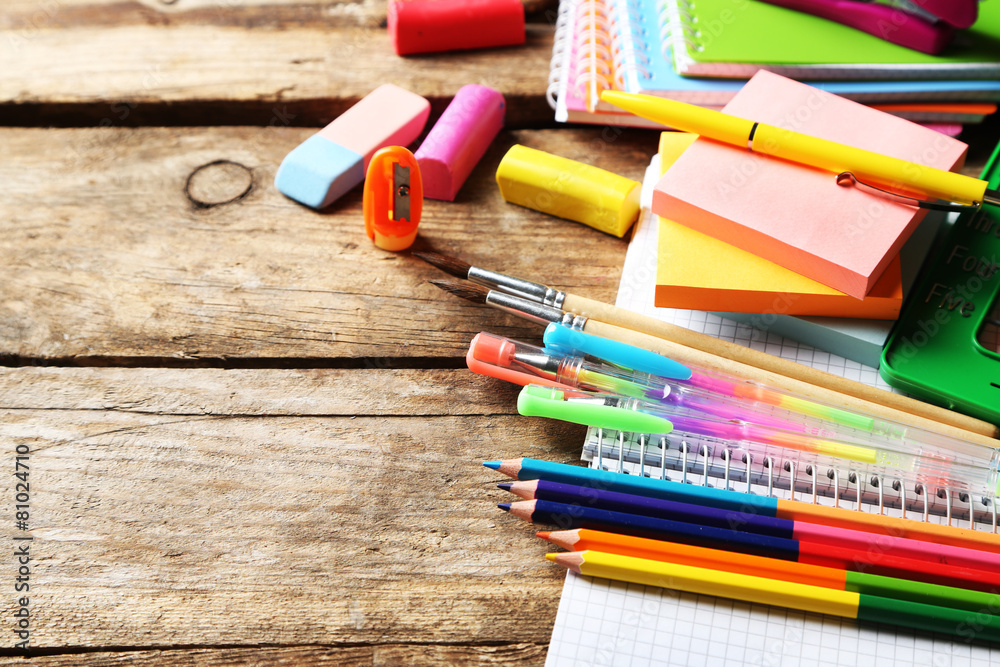 Fototapeta premium Bright school stationery on old wooden table