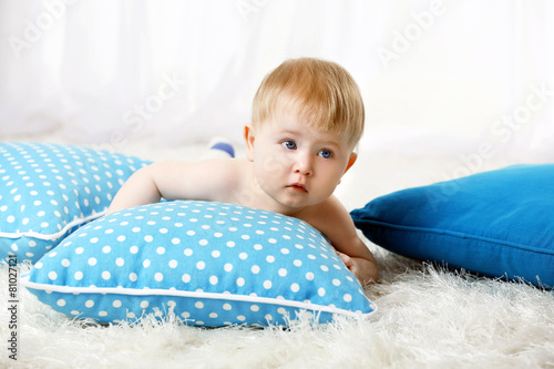 Cute baby boy on carpet, on...