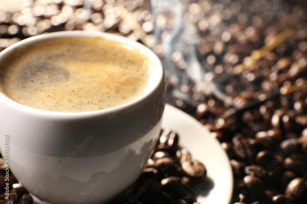 Cup of coffee with grains, closeup Cup of coffee with grains, closeup