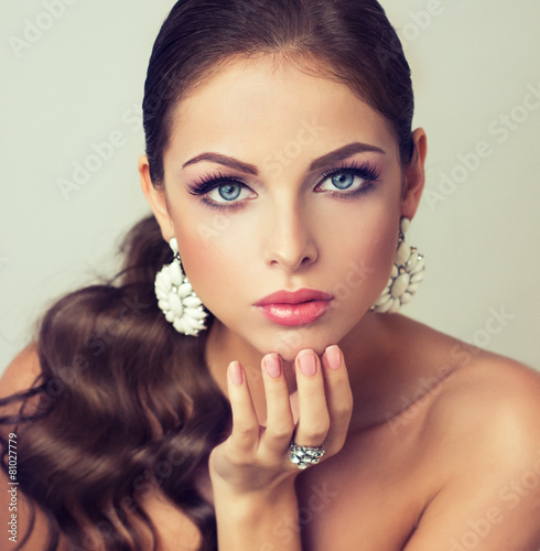 Girl fashion model with  graceful earrings and ring
