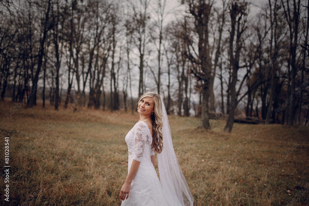 bride walking in golden autumn nature