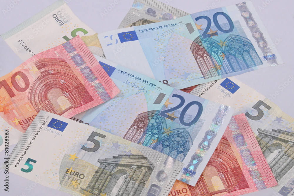 Euro notes on a plain white background. Euro notes on a plain white background.