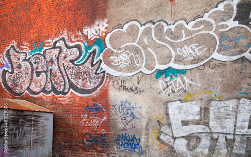 Urban brick wall with grungy graffiti