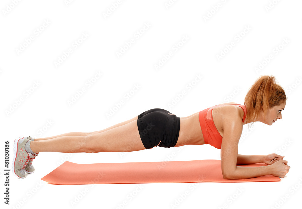 Woman doing exercises on a mat