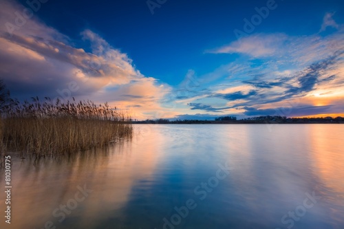 Beautiful lake with colorful sunset sky. 