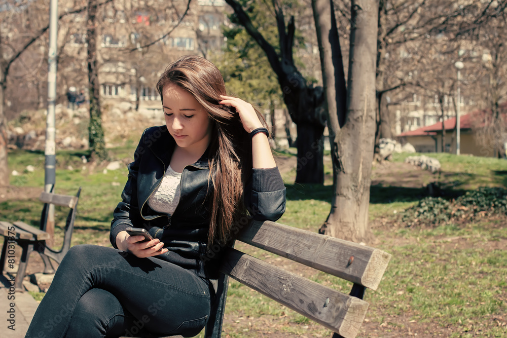 Girl Texting On The Smart Phone Girl Texting On The Smart Phone
