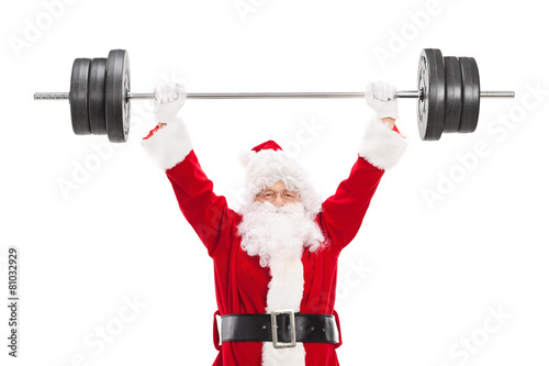 Smiling Santa Claus lifting a heavy barbell